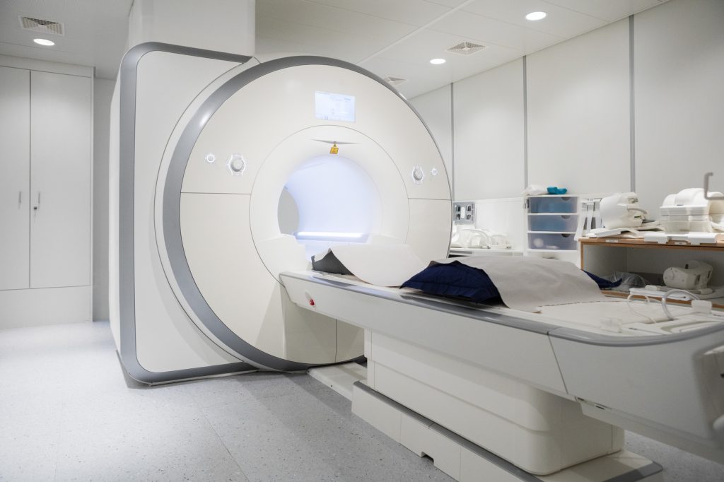 White MRI machine in empty hospital room
